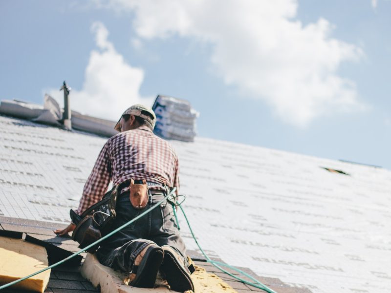 roofer-adding-shingles-to-the-roof-of-a-house.jpg